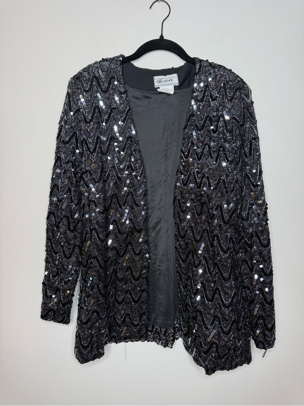 vintage Teddi of California sequin jacket featuring a striking black and silver